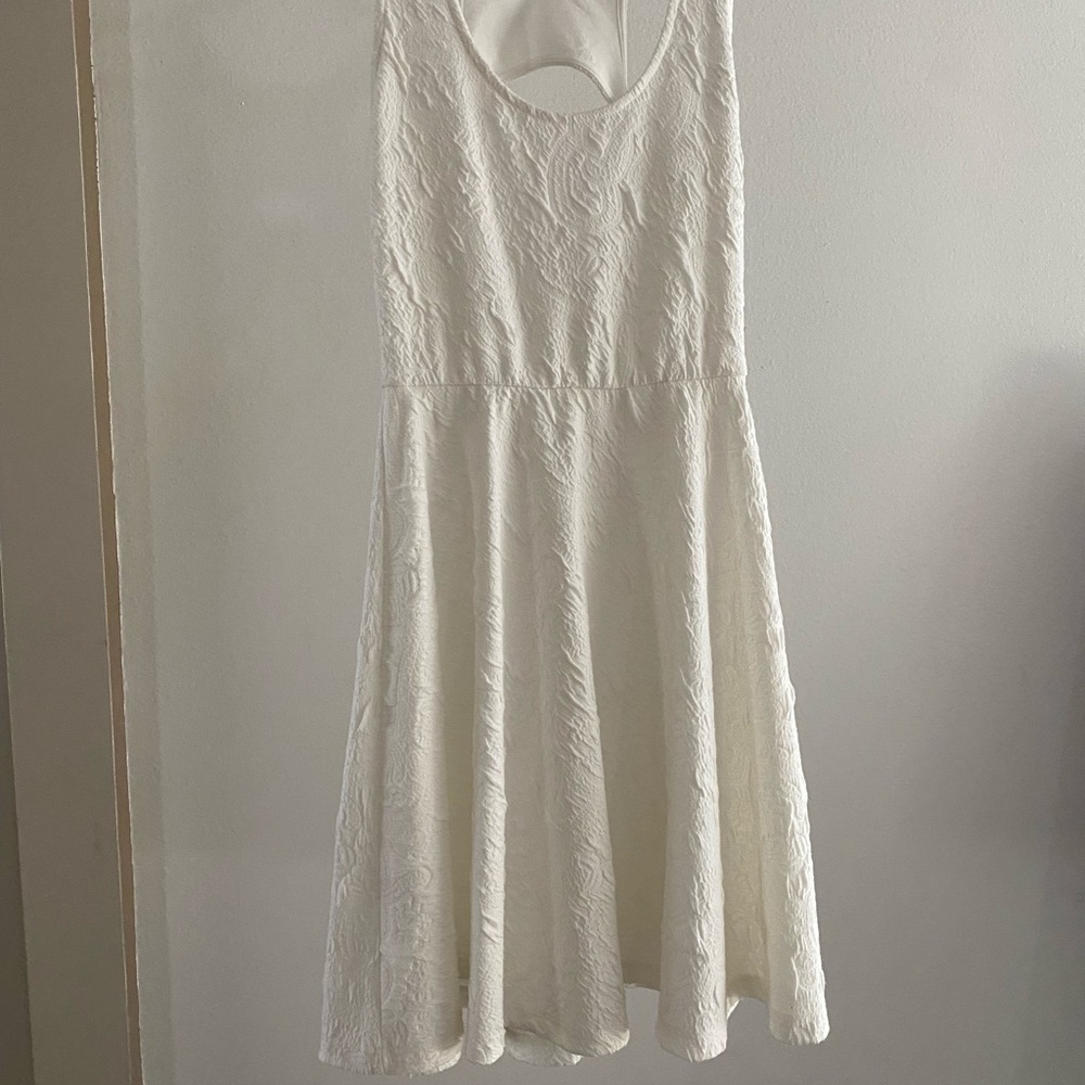 White Size small boutique dress. Fit and flare with raised pattern. Not see-thru